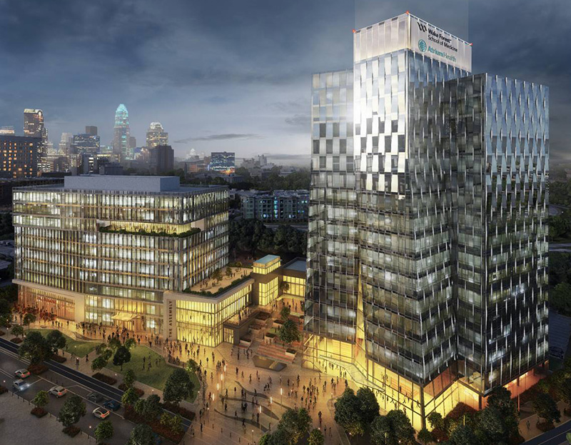 Architect rendering of tall steel-and-glass building at night against Charlotte skyline