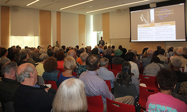 Crowd attending lecture on Alzheimer's disease research