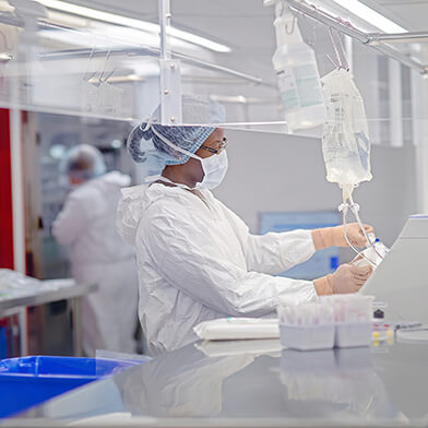 A medical professional working with medical equipment.